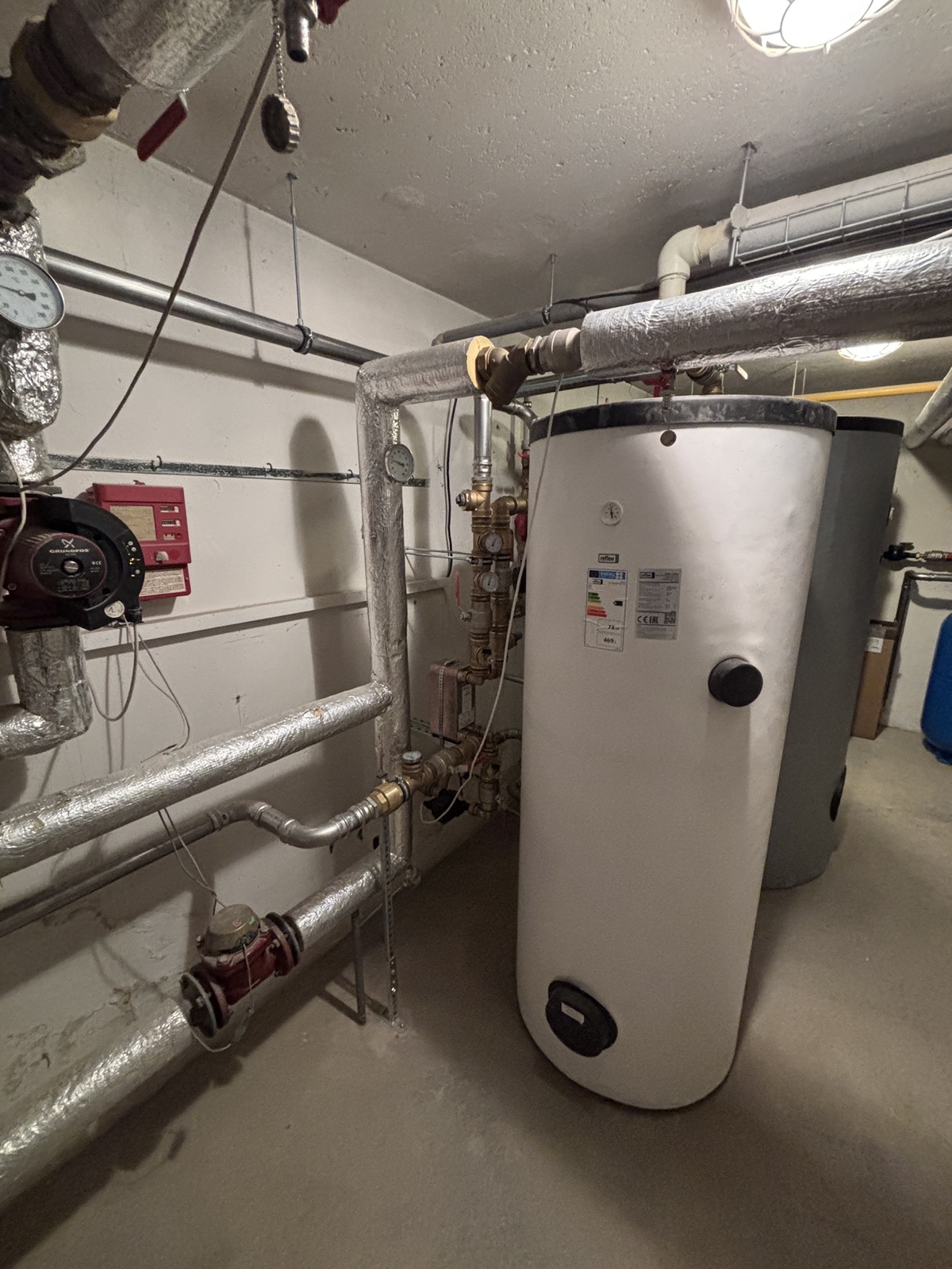 Heating and plumbing works – hot water tank and heat pumps